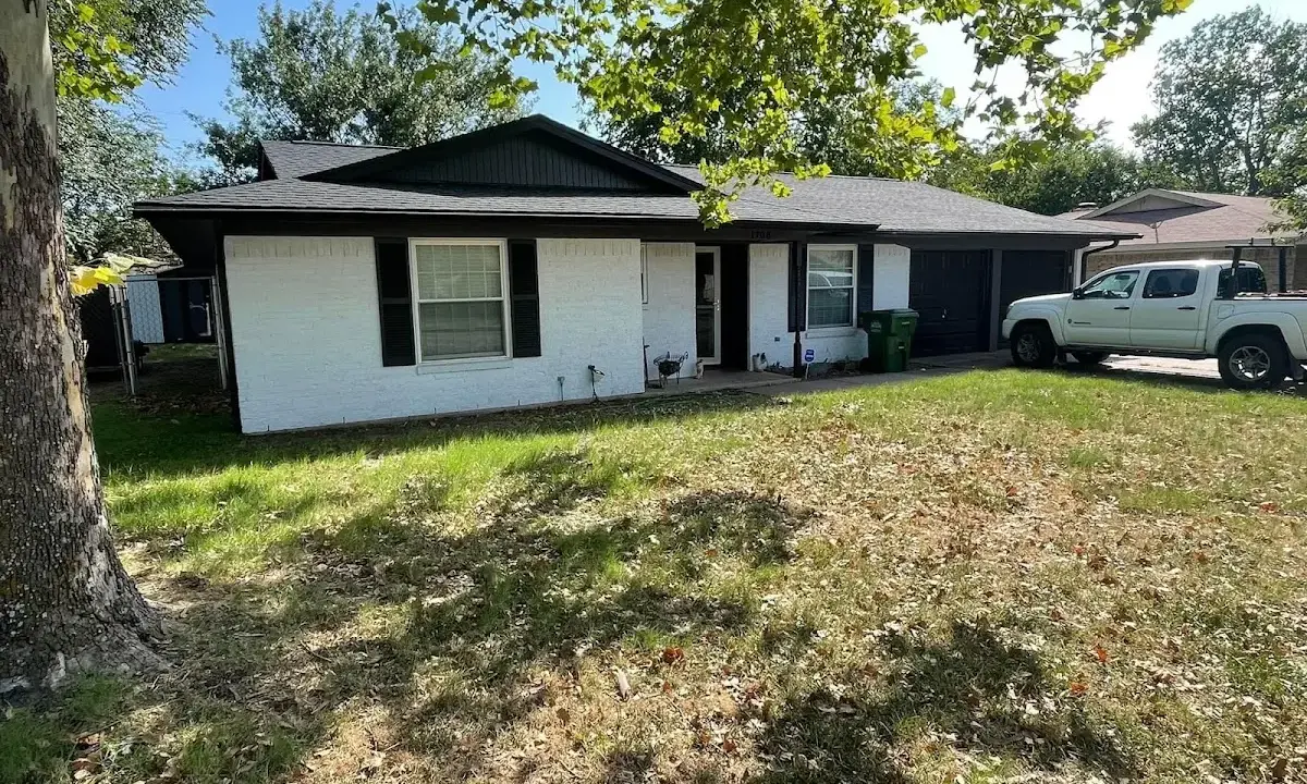 Professional roofing crew working on a residential roof in Northfield